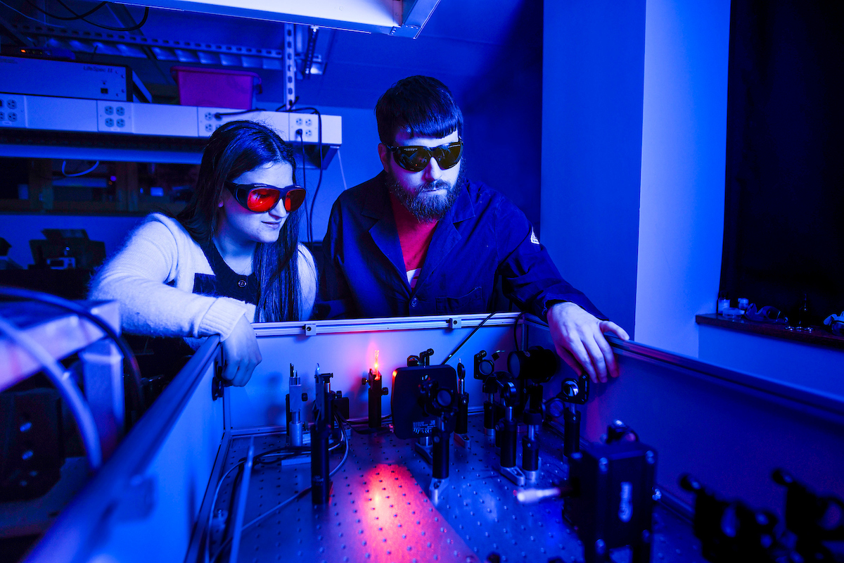 Students work in a laser lab on Centennial campus. Photo by Marc Hall
